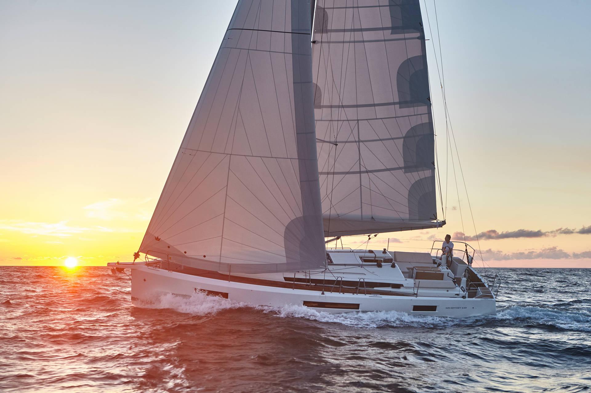 Scout Yacht Club sailing at sunset